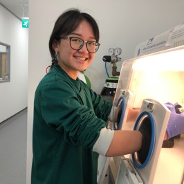 Studentship students working in a lab