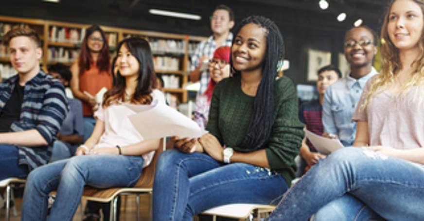 Row of undergraduate students sitting on chairs