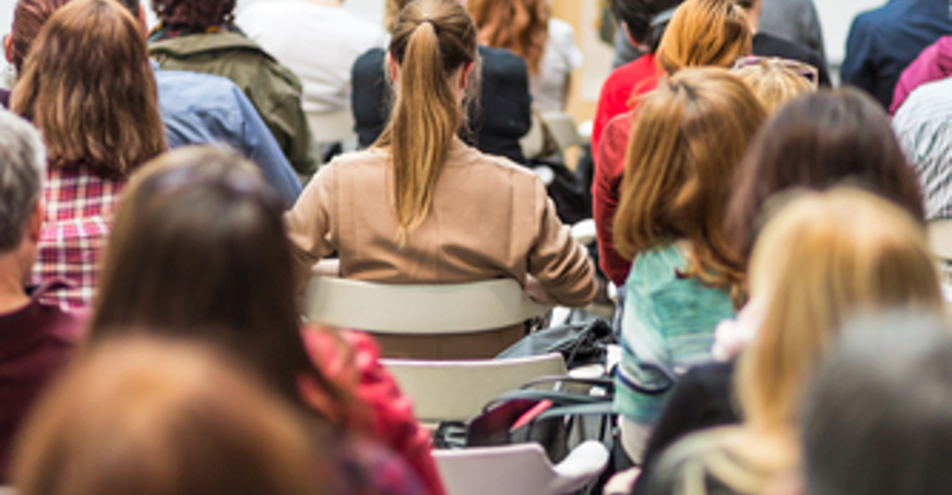 Group of people attending a lecture