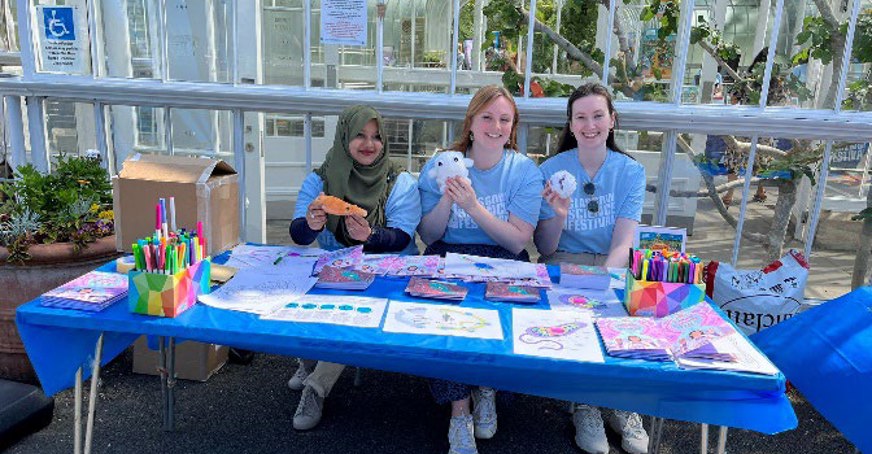 Volunteers carrying out outreach activity based on Leishmania parasite