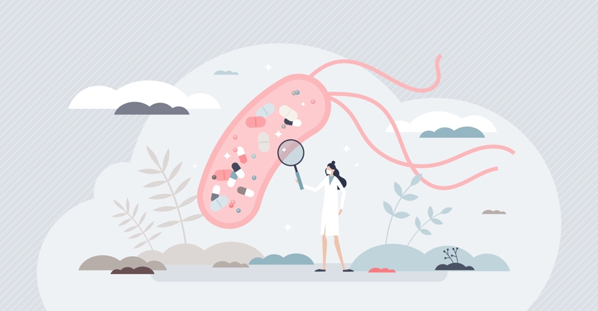 Cartoon microbe being examined with a microscope by a scientists